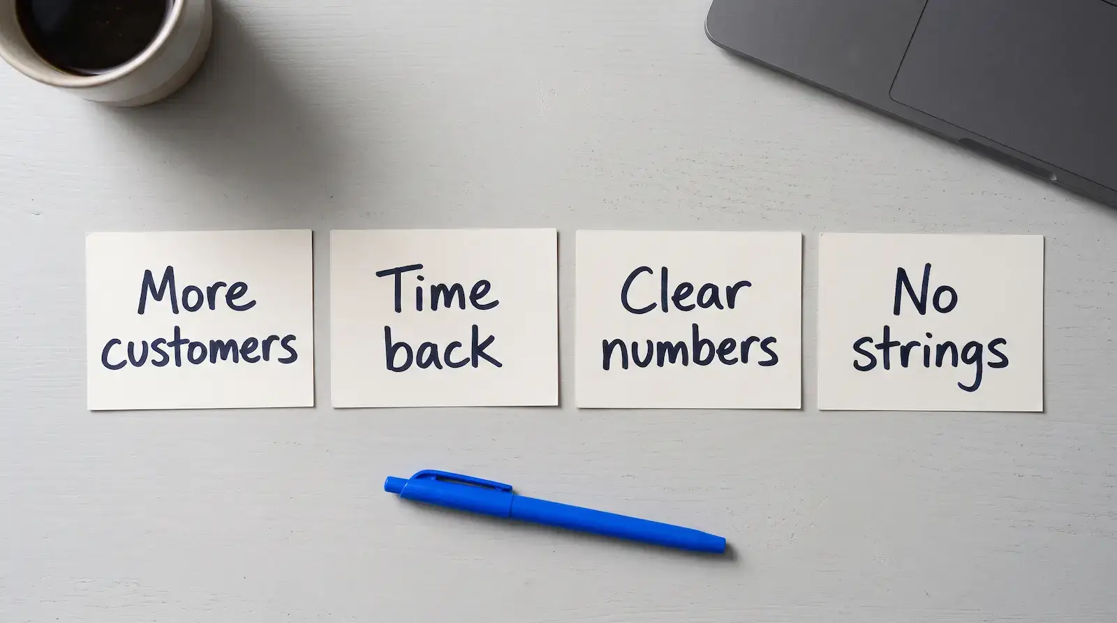 Four index cards reading More customers, Time back, Clear numbers and No strings